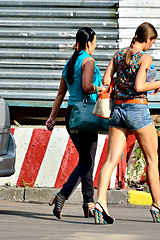 High heeled gal in jeans shorts